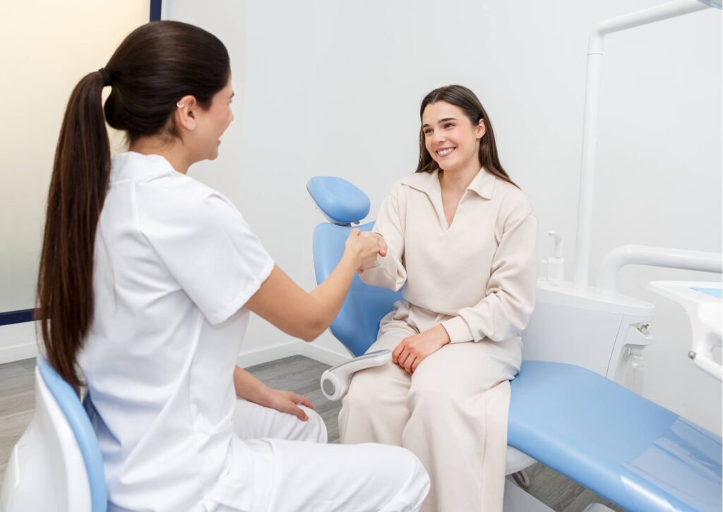Patient finishing a root canal consultation with a dentist before deciding whether it is safe to drive home.